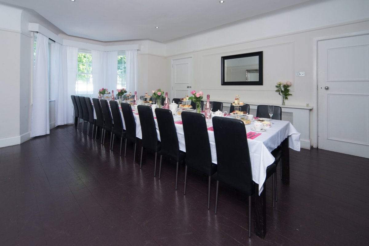 Bournemouth Boutique - dining room set up for a large group celebration dinner